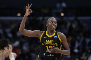 FILE - Los Angeles Sparks forward Chiney Ogwumike (13) celebrates after a three-pointer during the second half of a WNBA basketball game against the Phoenix Mercury in Los Angeles, Friday, May 19, 2023. Ogwumike has always been passionate about her Nigerian heritage. Now she's getting a chance to help all of Africa as a member of the inaugural President's Advisory Council on African Diaspora Engagement in the United States, the White House announced Tuesday, Sept. 26, 2023. (AP Photo/Ashley Landis, File)