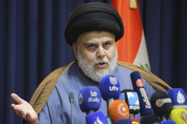 FILE - Populist Shiite cleric Muqtada al-Sadr, speaks during a mews conference in Najaf, Iraq, Thursday, Nov. 18, 2021. On Sunday, June 12, 2022, 73 lawmakers from the powerful cleric’s bloc submitted their resignation based on his request, to protest a persisting political deadlock eight months after general elections were held. (AP Photo/Anmar Khalil, File)