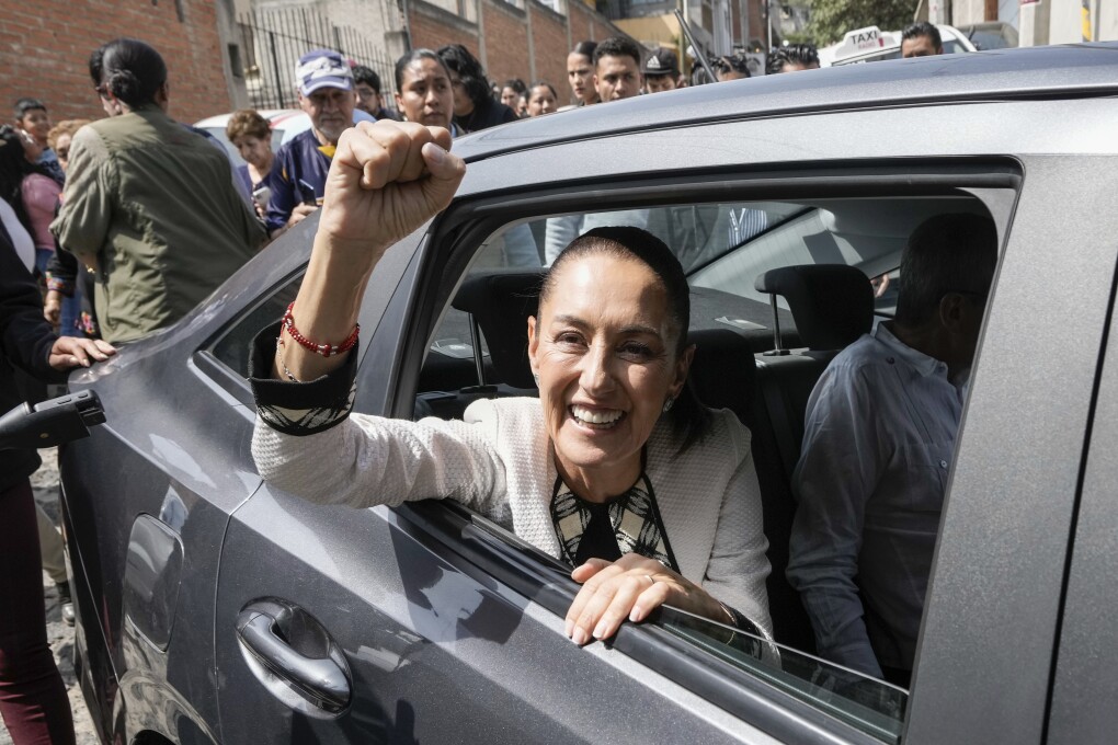 Ruling party presidential candidate Claudia Sheinbaum leaves the polling station where she voted during general elections in Mexico City, Sunday, June 2, 2024. (AP Photo/Eduardo Verdugo)