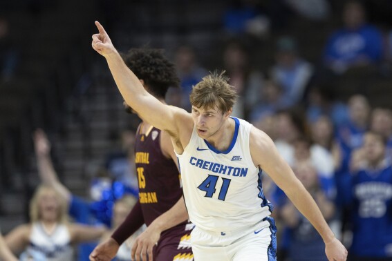 FILE - Creighton's Isaac Traudt (41) celebrates after making a three-pointer against Central Michigan during the first half of an NCAA college basketball game Saturday, Dec. 9, 2023, in Omaha, Neb. Traudt was diagnosed with Type 1 diabetes 16 years ago, at age 4, and he's never let it stop him from pursuing the sport he loves. (AP Photo/Rebecca S. Gratz, File)