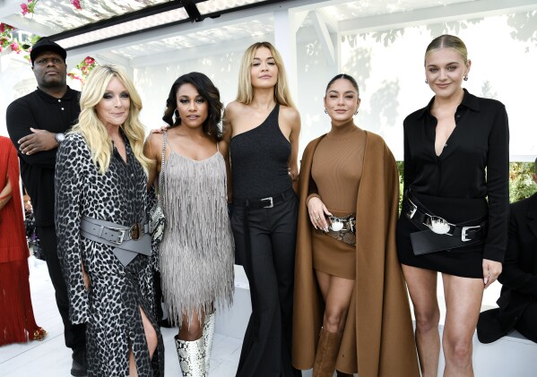 Jane Krakowski, foreground from left, Ariana DeBose, Rita Ora, Vanessa Hudgens and Kelsea Ballerini attend the Michael Kors Spring/Summer 2024 fashion show as part of New York Fashion Week on Monday, Sept. 11, 2023, in New York. (Photo by Evan Agostini/Invision/AP)