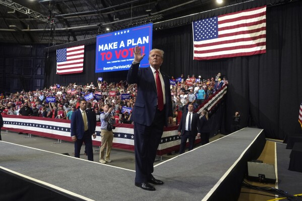 FILE - Republican presidential nominee former President Donald Trump waves after speaking at a campaign rally in Bozeman, Mont., Friday, Aug. 9, 2024. (AP Photo/Rick Bowmer, File)