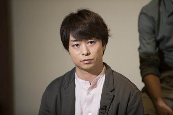 FILE - Sho Sakurai, a member of Japanese pop music band ARASHI, listens to a question during an interview with The Associated Press in Tokyo on Sept. 17, 2020. Beverage maker Asahi Group Holdings — known for its Super Dry beer — will no longer air its ads featuring Junichi Okada, Toma Ikuta and Sho Sakurai, the company said Tuesday, Sept. 12, 2023, and there are no plans to sign singers, dancers or actors affiliated with Johnny’s. (AP Photo/Hiro Komae, File)