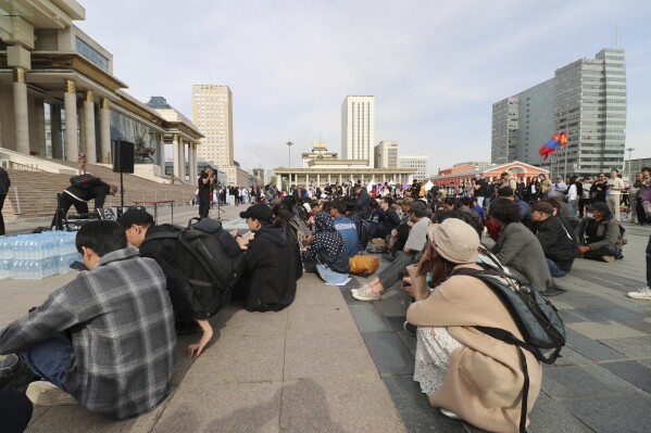 Protestors gather at a rally calling for the Prime Minister's resignation at the Sukhbaatar Square in Ulaanbaatar, Mongolia, Thursday, May 22, 2025. (AP Photo/Ganbat Namjilsangarav)