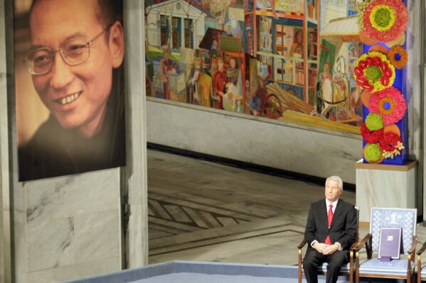 FILE - Nobel Commitee chairman Thorbjorn Jagland sits next to an empty chair with the Nobel Peace Prize medal and diploma during a ceremony honoring Nobel Peace Prize laureate Liu Xiaobo at city hall in Oslo, Norway, on Dec. 10, 2010. The head of the Norwegian Nobel Committee on Friday, Oct. 6, 2023 urged Iran to release imprisoned peace prize winner Narges Mohammadi and let her accept the award at the annual prize ceremony in December. Such appeals have had little effect in the past. Liu Xiaobo was serving an 11-year sentence for inciting subversion by advocating sweeping political reforms and greater human rights in China when the Norwegian Nobel Committee selected him for the peace prize in 2010. (AP Photo/John McConnico, File)