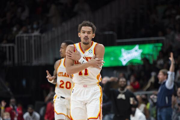 Atlanta Hawks guard Trae Young (11) reacts after making a 3-pointer during the second half of the team's NBA basketball game against the Minnesota Timberwolves on Wednesday, Jan. 19, 2022, in Atlanta. (AP Photo/Hakim Wright Sr.)