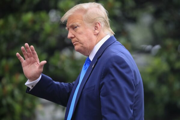 President Donald Trump gestures as he walks across the South Lawn of the White House in Washington, Saturday, July 11, 2020. Trump was returning from a visit to nearby Walter Reed National Military Medical Center in Bethesda, Md. (AP Photo/Pablo Martinez Monsivais)