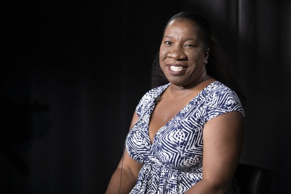 In this Friday, Oct. 11, 2019, photo Tarana Burke, founder and leader of the #MeToo movement, poses for a portrait in New York. Burke is using the second anniversary of the movement to launch a new effort intended to mobilize voters heading into the 2020 election.  The new hashtag #MeTooVoter was unveiled Tuesday, Oct. 15 on the same day as the fourth Democratic presidential debate and reflects a frustration among activists that issues of sexual violence and harassment have largely been absent from the debate stage and campaign trail.  (AP Photo/Mary Altaffer)