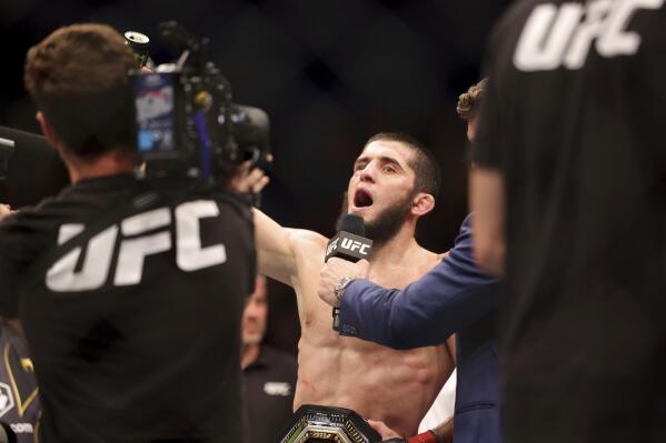 Islam Makhachev of Russia racts after winning his fight against Alex Volkanovski of Australia during their lightweight title bout in the main event of UFC 284 at RAC Arena in Perth, Australia, Sunday, Feb. 12, 2023. (Richard Wainwright/AAP Image via AP)