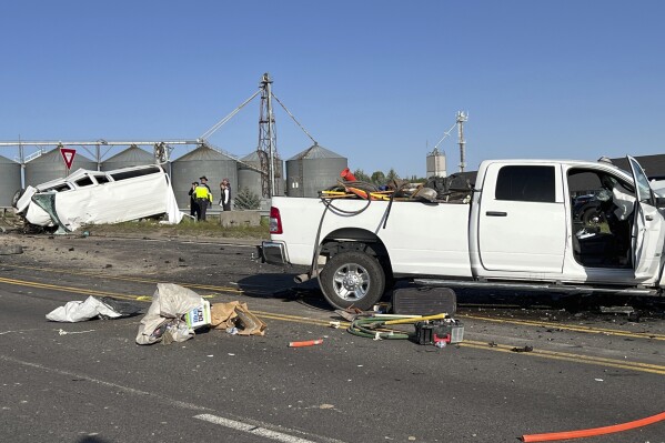 In this file photo provided by KIFI Local News 8, a pickup truck crashed into a passenger van on U.S. Highway 20, Saturday, May 18, 2024, in Idaho Falls, Idaho. The six people killed when a pickup crashed into a passenger van in Idaho over the weekend were agricultural workers from Mexico, officials said. (Jeff Roper/KIFI Local News 8 via AP, File)