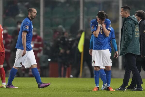 Italy's Jorginho, right, cries as his teammate walks after their team's got eliminated in the World Cup qualifying play-offsoccer match between Italy and North Macedonia, at Renzo Barbera stadium, in Palermo, Italy, Thursday, March 24, 2022. North Macedonia won 1-0. (AP Photo/Antonio Calanni)