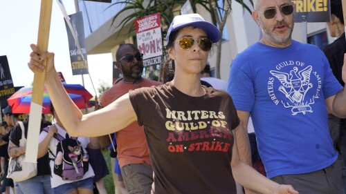 Sarah Silverman, left, pickets outside Netflix studios on Thursday, July 20, 2023, in Los Angeles. The actors strike comes more than two months after screenwriters began striking in their bid to get better pay and working conditions. (AP Photo/Chris Pizzello)