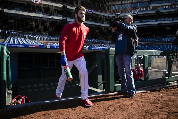 
              Philadelphia Phillies right fielder Bryce Harper takes the field for baseball practice, Tuesday, March 26, 2019, in Philadelphia. (AP Photo/Matt Rourke)
            