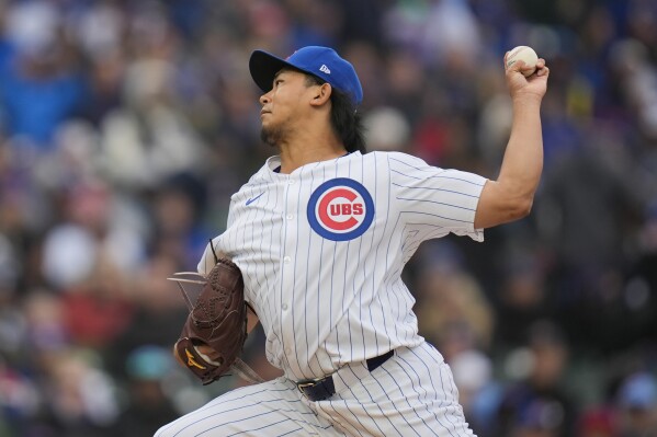 Chicago Cubs starting pitcher Shota Imanaga throws against the Colorado Rockies during the first inning of a baseball game Monday, April 1, 2024, in Chicago. (AP Photo/Erin Hooley)