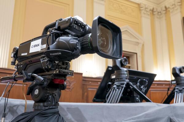 FILE - Television crews and technicians prepare the Cannon Caucus Room for Thursday night's hearing by the House select committee investigating the attack of Jan. 6, 2021, at the Capitol in Washington, June 7, 2022. (AP Photo/J. Scott Applewhite, File)