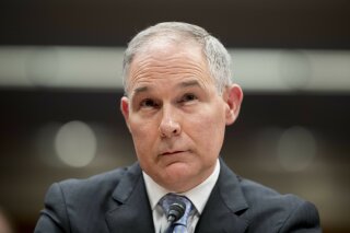 FILE - In this May 16, 2018 file photo, Environmental Protection Agency Administrator Scott Pruitt appears before a Senate Appropriations subcommittee on the Interior, Environment, and Related Agencies on budget on Capitol Hill in Washington. Federal ethics officials are balking at a $50-a-night condo deal by former Environmental Protection Agency chief Scott Pruitt. The federal Office of Government Ethics said in a finding posted Tuesday that it would not approve one of Pruitt’s last financial disclosure reports after his resignation amid ethics scandals last July. Pruitt rented a condo from the wife of a lobbyist for a bargain rate of $50 a night. Pruitt insisted it was a proper business arrangement. Critics called it an improper gift linked to a lobbyist who did business before the EPA. (AP Photo/Andrew Harnik, File)