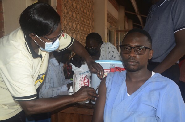 A man receives a shot of yellow fever vaccine at Kiswa Health Center III in Kampala, Uganda Tuesday, April. 2, 2024. Uganda has rolled out a nationwide yellow fever vaccination campaign to help safeguard its population against the mosquito-borne disease that has long posed a threat. (AP Photo)