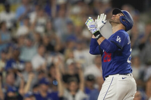 Los Angeles Dodgers designated hitter J.D. Martinez celebrates his home run against the Toronto Blue Jays during the eighth inning of a baseball game Tuesday, July 25, 2023, in Los Angeles. (AP Photo/Ryan Sun)