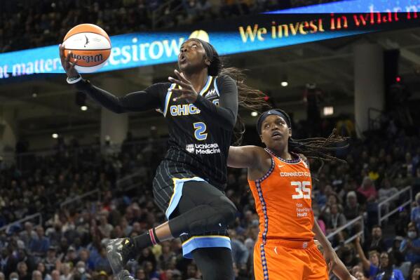 Chicago Sky's Kahleah Copper drives to the basket past Connecticut Sun's Jonquel Jones during the second half in Game 1 of a WNBA basketball semifinal playoff series Sunday, Aug. 28, 2022, in Chicago. The Sun won 68-63. (AP Photo/Charles Rex Arbogast)