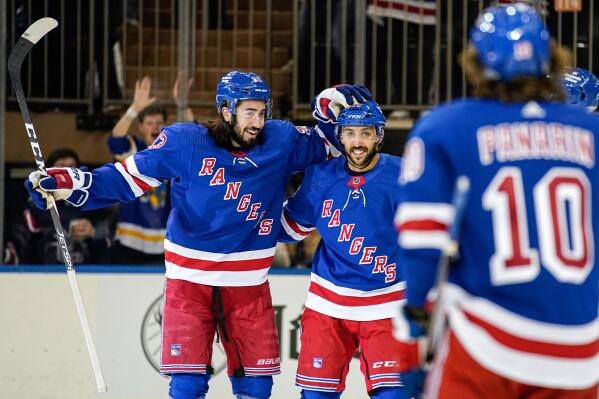 New York Rangers defenseman center Mika Zibanejad, left, and center Vincent Trocheck celebrate Trocheck's goal during the first period of an NHL hockey game against the Anaheim Ducks, Monday, Oct. 17, 2022, in New York. (AP Photo/Julia Nikhinson)