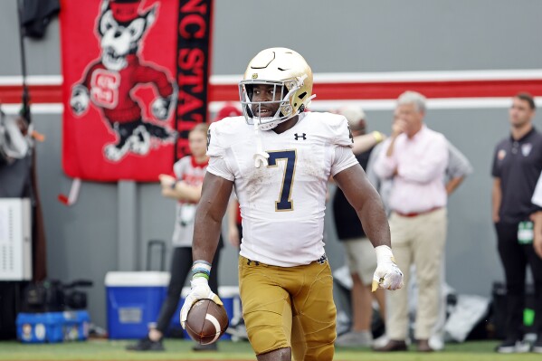 Notre Dame's Audric Estime (7) celebrates his touchdown during the second half of an NCAA college football game against North Carolina State in Raleigh, N.C., Saturday, Sept. 9, 2023. (AP Photo/Karl B DeBlaker)