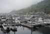 A person walks across the dock at St. Paul Harbor, Thursday, June 22, 2023, in Kodiak, Alaska. Crab fishermen in Alaska have been scrambling to stay afloat after two years of the Bering Sea fishery being closed or severely curtailed due to plummeting crab numbers. (AP Photo/Joshua A. Bickel)