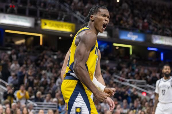 Indiana Pacers guard Bennedict Mathurin (00) reacts after being fouled while scoring during the second half of an NBA basketball game against the Brooklyn Nets in Indianapolis, Friday, Nov. 25, 2022. (AP Photo/Doug McSchooler)