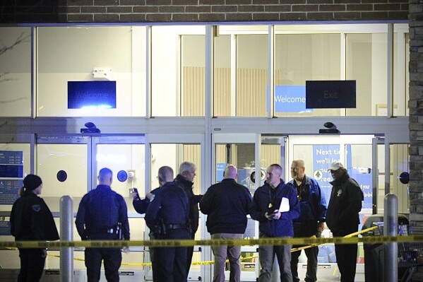Police respond to the scene of a shooting on Monday, Nov. 20, 2023 in Beavercreek, Ohio. Police say a shooter opened fire at a Walmart, wounding four people before apparently killing himself. The attack took place Monday night at a Walmart in Beavercreek, in the Dayton metropolitan area. (Marshall Gorby/Dayton Daily News via AP)