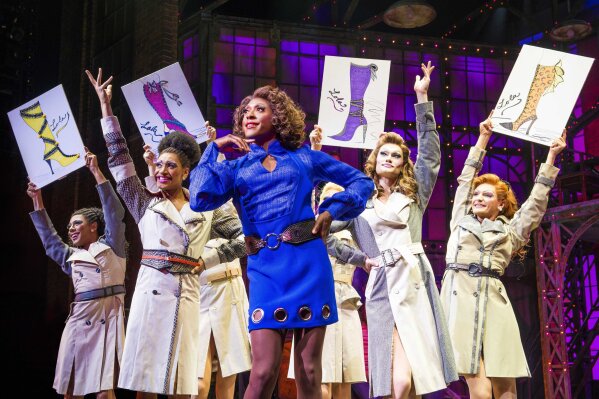 This image released by BroadwayHD shows Matt Henry as Lola, center, in the London production of "Kinky Boots." While opera has long made it to TV, media companies like Netflix, Fanthom Events, Audible Inc. and BroadwayHD are reshaping what theater can be, evolving it past the quaint notion of patrons filing into an arena, turning off their phones and sitting quietly in the dark.  (Matt Crockett/BroadwayHD via AP)
