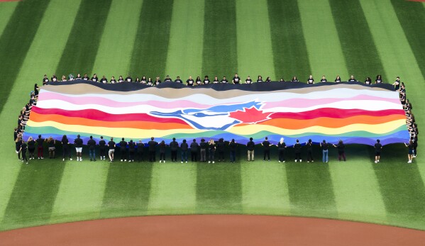 GAY PRIDE WEEKEND, LGBTQ, BLUE JAYS VS. TWINS RAINBOW FLAG JERSEY  GIVEAWAY COMMERCIAL