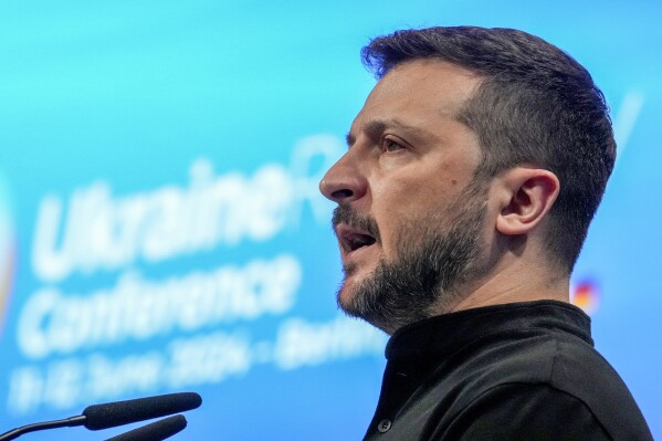 Ukrainian President Volodymyr Zelenskyy speaks during the opening ceremony of the recovery conference in Berlin, Germany, Tuesday, June 11, 2024. Germany is hosting a conference to gather support for Ukraine's recovery from the destruction wreaked by Russia's war, sending a new signal of solidarity with Kyiv at the start of a week of intense diplomacy. (AP Photo/Ebrahim Noroozi)
