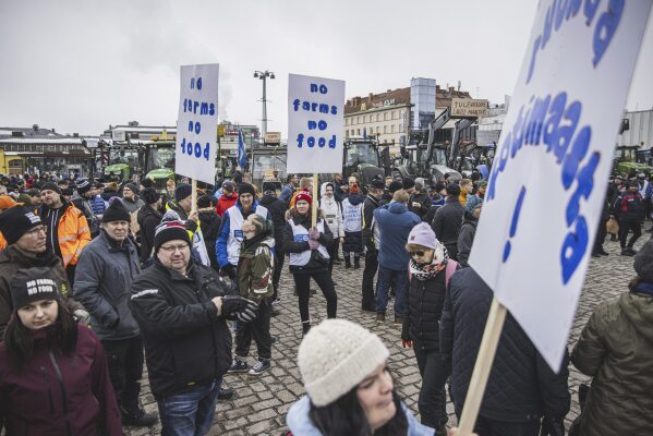 Tractors are parked in market square during "a food march" in Kuopio, central Finland, on Friday March 22, 2024 as farmers protest against perceived inequalities in food production profits. (Akseli Muraja/Lehtikuva via AP)
