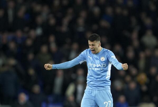 Manchester City's Joao Cancelo heads the ball during the Champions