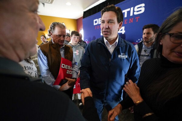 FILE - Republican presidential candidate Florida Gov. Ron DeSantis talks with audience members during a meet and greet, Friday, Nov. 3, 2023, in Denison, Iowa. Former President Donald Trump was the first choice of 51% of likely Iowa caucus participants in a Des Moines Register-NBC News-Mediacom Iowa Poll published Monday, Dec. 11. Florida Gov. Ron DeSantis, who has vowed that he will win Iowa, had the support of 19%. (AP Photo/Charlie Neibergall, File)