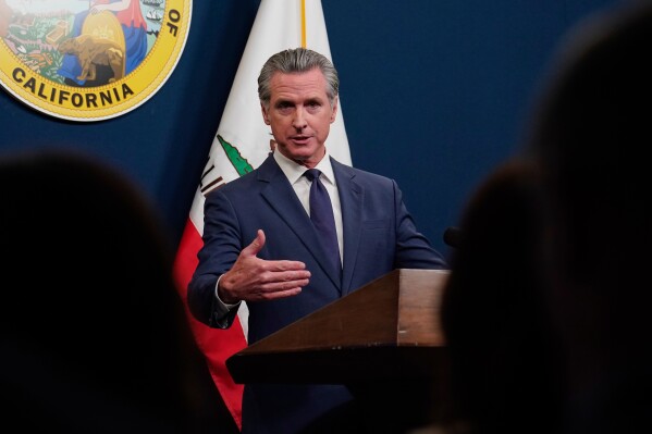 Calif. Gov. Gavin Newsom presents his revised 2025-2026 state budget during a news conference in Sacramento, Calif., Wednesday, May 14, 2025. (AP Photo/Rich Pedroncelli)