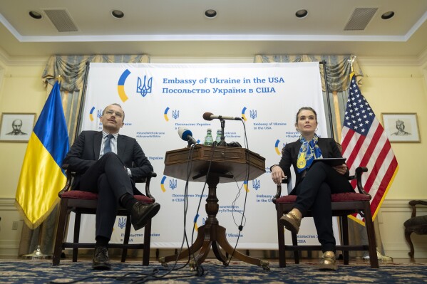 Ukraine's Minister of Justice Denys Maliuska, left, and Deputy Minister of Justice Iryna Mudra attend a press conference at the Embassy of Ukraine on Wednesday, March 13, 2024, in Washington. (AP Photo/Mark Schiefelbein)
