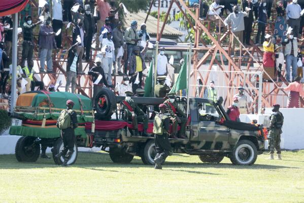 The vehicle carrying the casket of Founding President Kenneth Kaunda arrives for his State Funeral Service at showgrounds in Lusaka, Zambia, Friday, July 2, 2021. Zambia’s first president Kenneth Kaunda died at the age of 97 in June. (AP Photo/Tsvangirayi Mukwazhi)