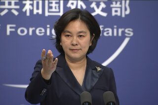 Chinese Foreign Ministry spokesperson Hua Chunying speaks during the daily press briefing at the Foreign Ministry in Beijing on Wednesday, Jan. 20, 2021. China's Foreign Ministry described outgoing U.S. Secretary of State Mike Pompeo on Wednesday as a "doomsday clown" and said his designation of China as a perpetrator of genocide and crimes against humanity was merely "a piece of wastepaper." (AP Photo/Liu Zheng)