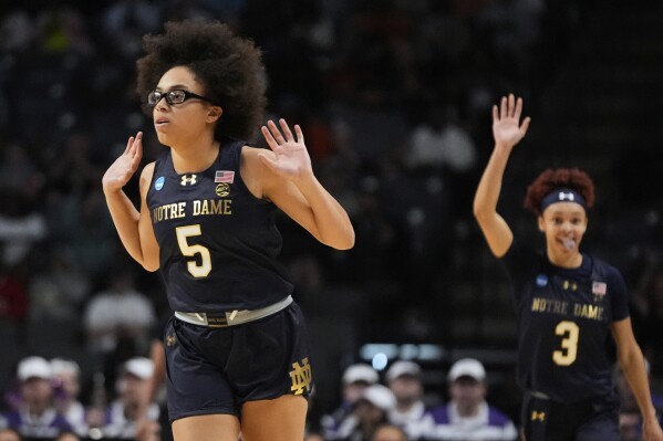 Notre Dame guard Olivia Miles (5) reacts after making a 3-point basket against TCU during the first half in the Sweet 16 of the NCAA college basketball tournament, Saturday, March 29, 2025. in Birmingham, Ala. (AP Photo/Gerald Herbert)