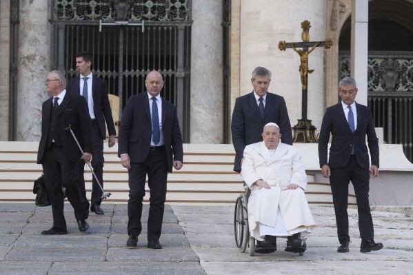 Pope Francis leaves at the end of his weekly general audience in St. Peter's Square at the Vatican, Wednesday, March 6, 2024. (AP Photo/Gregorio Borgia)