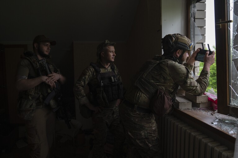 FILE - An officer of Ukraine's 59th Motorized Brigade controls a drone from a shelter in the suburbs of Donetsk, the site of fierce battles with the Russian forces, Ukraine, Friday, May 26, 2023. (AP Photo/Efrem Lukatsky, File)