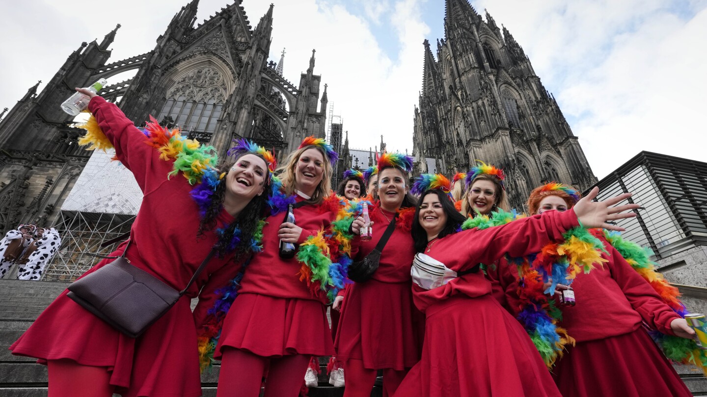 Carnival's women revelers take over the Rhineland for a day, dancing, drinking and kissing