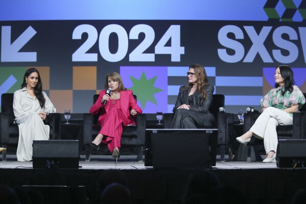 Meghan, The Duchess of Sussex, Katie Couric, Brooke Shields and Nancy Wang Yuen take part in the keynote "Breaking Barrier, Shaping Narratives: How Women Lead On and Off the Screen" on the first day of the South by Southwest Conference on Friday, March 8, 2024, in Austin, Texas. (Photo by Jack Plunkett/Invision/AP)