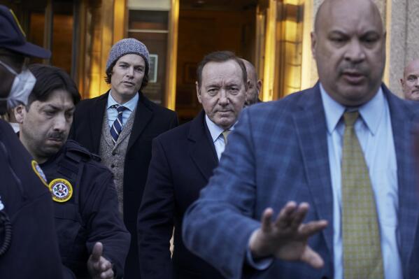 American actor Kevin Spacey, center, leaves the Daniel Patrick Moynihan Court House on Thursday, Oct. 20, 2022, in New York. A jury sided with Kevin Spacey on Thursday in one of the lawsuits that derailed the film star's career, finding he did not sexually abuse Anthony Rapp, then 14, while both were relatively unknown actors in Broadway plays in 1980s. (AP Photo/Andres Kudacki)