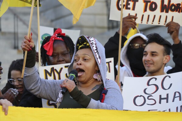 Shae Parker, a former Waffle House employee, rallies fellow Union of Southern Service Workers members outside the State House in Columbia, S.C. on Thursday, Dec. 7, 2023. Labor organizers petitioned the federal government to take control of workplace safety oversight from South Carolina regulators. (AP Photo/James Pollard)