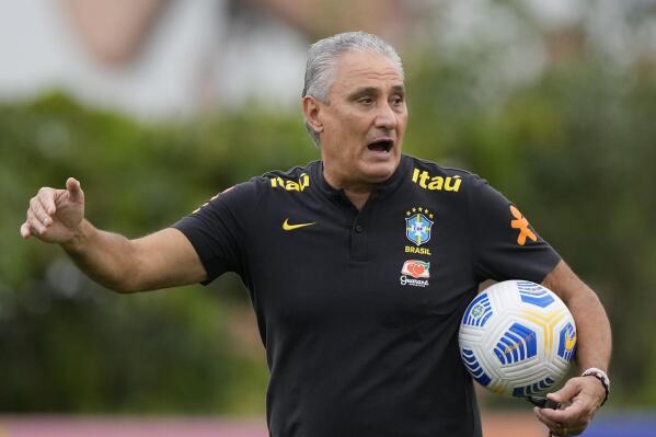 FILE - Brazil's Coach Tite gives instructions during a national soccer team training session, in Sao Paulo, Brazil, Nov. 10, 2021. Tite on Thursday, Jan. 13, 2022, announced his squad for two upcoming World Cup qualifier matches, leaving out injured star Neymar and noting that defender Renan Lodi wasn't selected because he hasn't been vaccinated against COVID-19. (AP Photo/Andre Penner, File)
