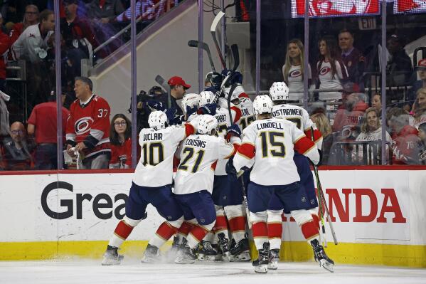 The Florida Panthers celebrate an apparent goal by Ryan Lomberg that was later disallowed, during the first overtime of Game 1 of the team's NHL hockey Stanley Cup Eastern Conference finals against the Carolina Hurricanes in Raleigh, N.C., Thursday, May 18, 2023. The Panthers won 3-2 in four overtimes. (AP Photo/Karl B DeBlaker)
