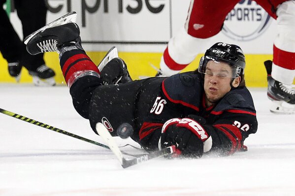 Carolina Hurricanes' Erik Haula (56) dives to the ice during the first period of the team's NHL hockey game against the Detroit Red Wings in Raleigh, N.C., Friday, Nov. 1, 2019. (AP Photo/Karl B DeBlaker)