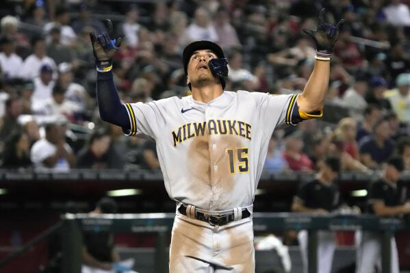 Tyrone Taylor of the Milwaukee Brewers celebrates after scoring on