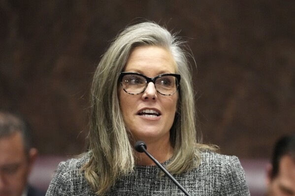 FILE - Arizona Democratic Gov. Katie Hobbs speaks as she gives the State of the State address, Jan. 9, 2023, at the Arizona Capitol in Phoenix. On Thursday, June 22, a lawsuit that alleged Hobbs exceeded her power in refusing to execute a prisoner was dismissed. The lawsuit had tried unsuccessfully to force Hobbs, who has vowed to not carry out death sentences until there’s confidence the state can do so without violating the law, to carry out the execution of Aaron Gunches for his murder conviction in the 2002 killing of Ted Price. (AP Photo/Ross D. Franklin, File)